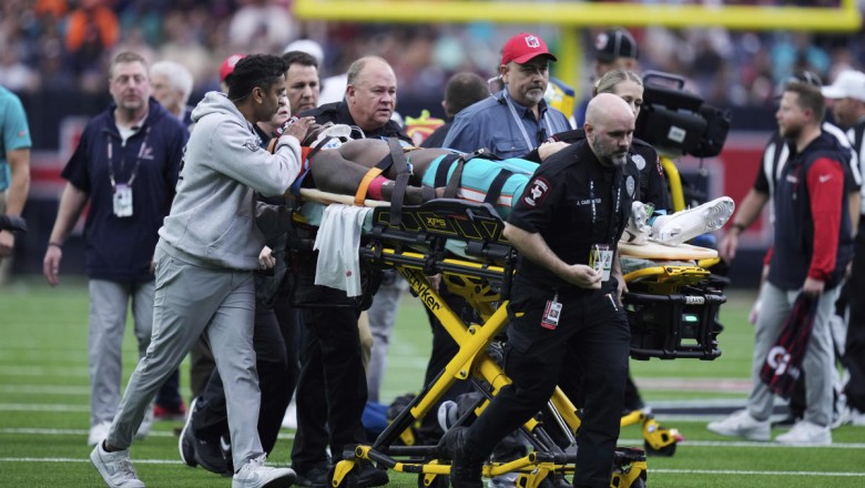 Dolphins WR Grant DuBose leaves field on stretcher with jersey cut off after frightening hit to head vs. Texans